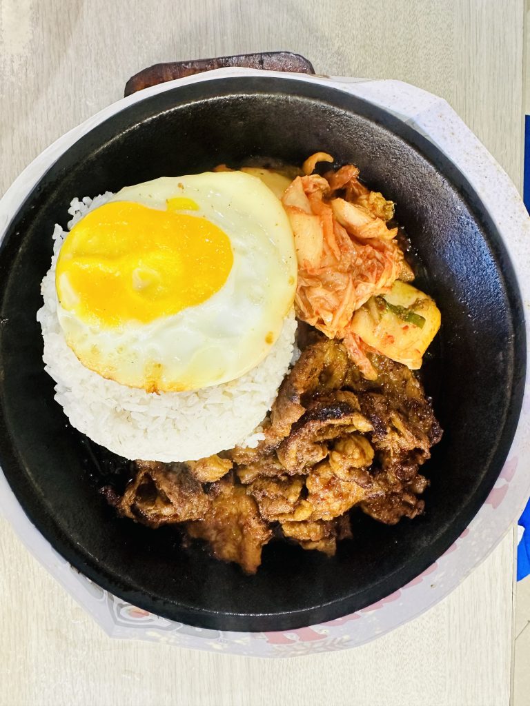 Popular lunch in Philippines includes rice, egg and chicken.