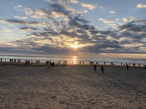 People joyfully observing the initial sunrise at Toyomi Coast, Chiba, Japan.