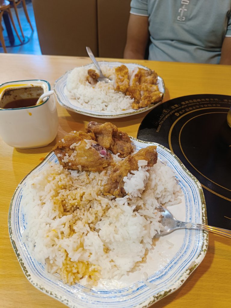 Crunchy pork with a side of rice.