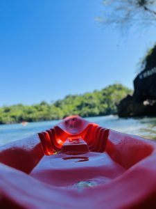 In frame is your point of view while riding on a kayak.