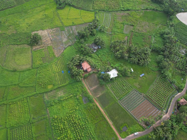 Aerial view of a farmland with a farmhouse.