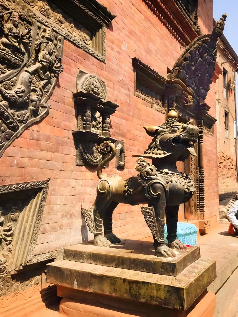 Stylized statue of a lion in Bhaktapur Durbar Square.