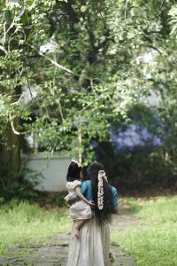 A women walking with her child