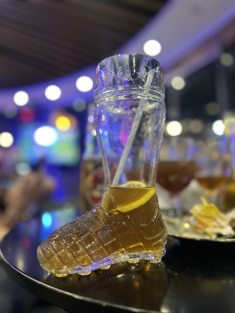 Boot shape mock tail glass in a table.