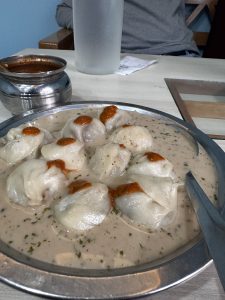 Momo food with creamy sauce.