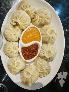 A platter filled with momo, the most widely embraced fast food in Nepal.