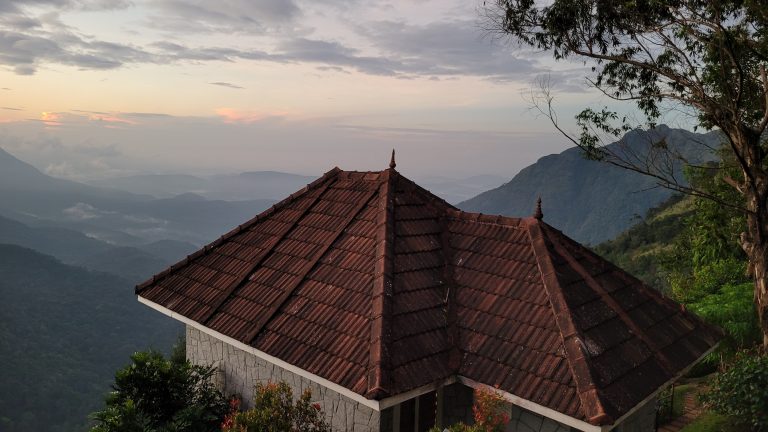 A beautiful sunrise view on a cloudy morning from a hilltop cottage.