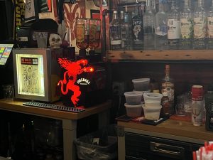 The back wall of a bar, featuring many different alcohols.