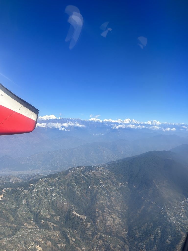 Aerial perspective of mountains from an aircraft.