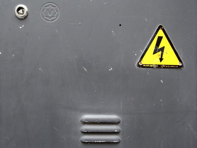 Maintenance closet door, with yellow warning sign