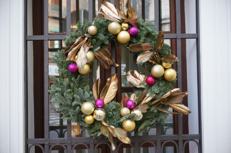 Christmas wreath hanging from a window