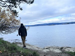 Man walking around Sea Beach, Victoria BC