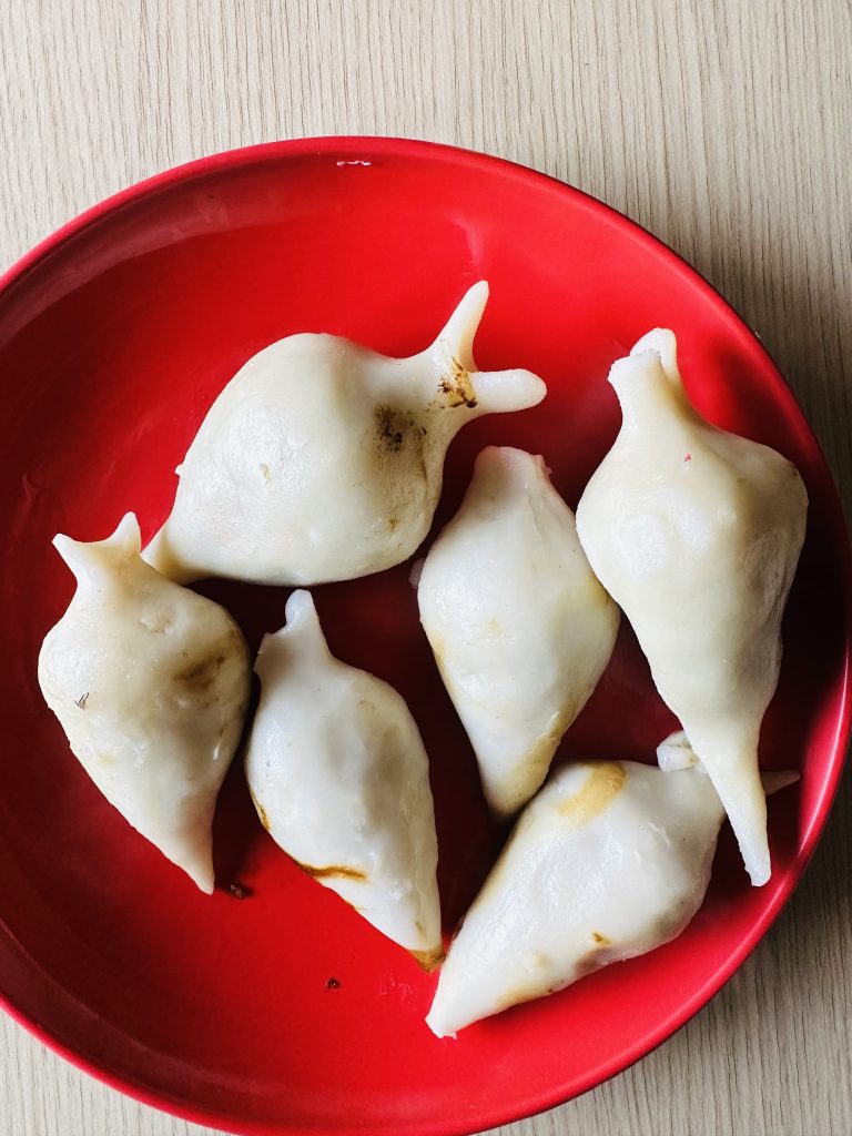 Yomari – It is a confection of rice flour dough shaped like fish and filled with brown cane sugar and sesame seeds, which is then steamed.