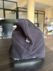 The table holds a winter cap.