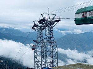 Darjeeling Passenger Ropeway pole and clouds in the back. 