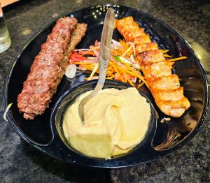 Chicken and beef kebab served with hummus. 