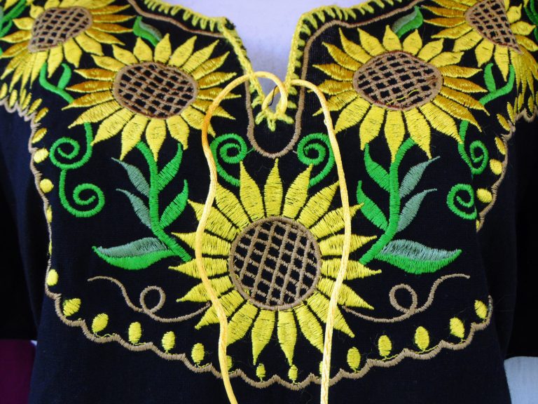 Mexican handcraft. A top with sunflowers stitched onto it.