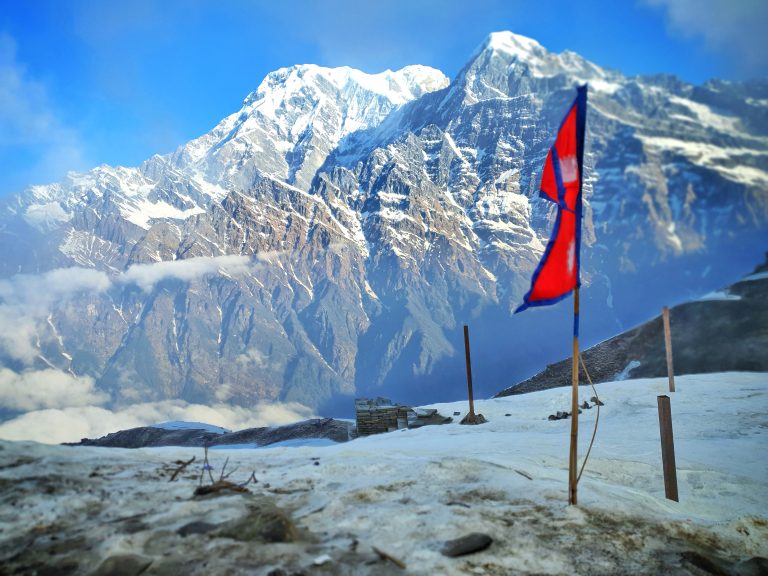 The scene observed from the Mardi viewpoint, along with the Nepalese flag displayed at the Mardi viewpoint.