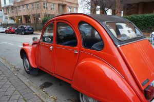 Vintage red car parked in the street