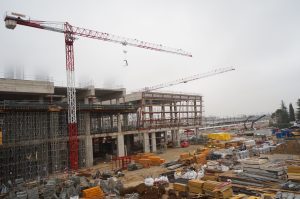 Side view of a construction site during a misty morning.
