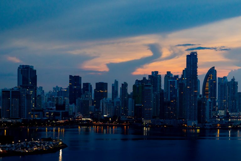 The sun rising behind the skyscrapers of Panama City