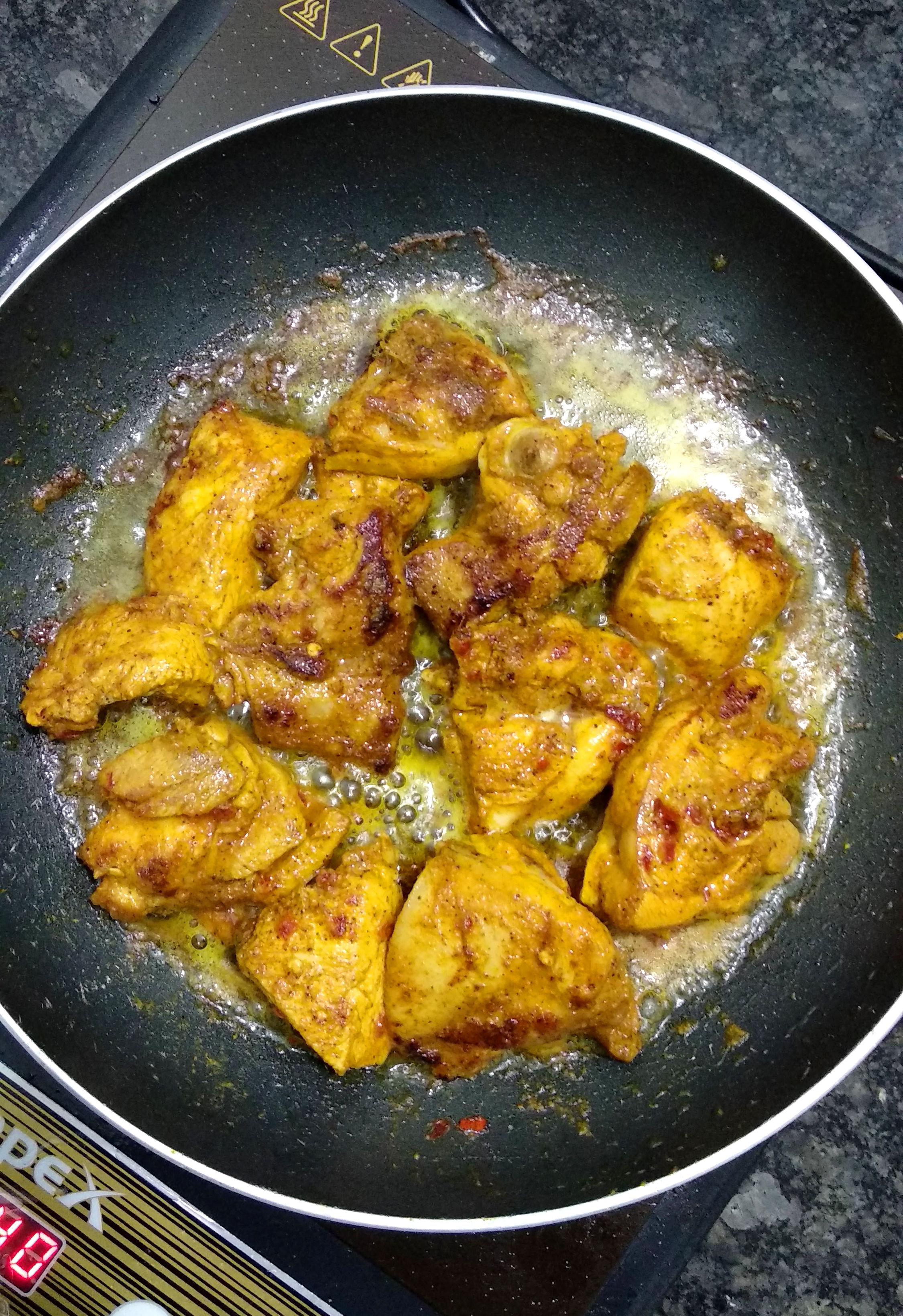 Frying chicken in the Southern style.