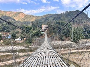 Bridging villages over a pristine river: A scenic suspension connection.