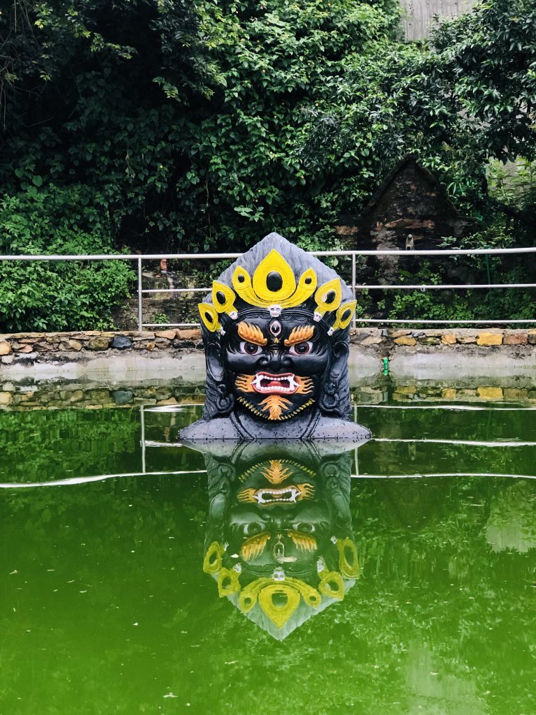 God Bhairava Head statue inside the pond at Kritipur Nepal