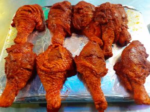 Chicken leg pieces marinated in a flavorful blend.