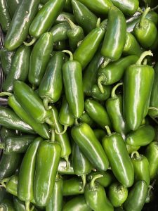Spicy green chili peppers known as jalapeños.