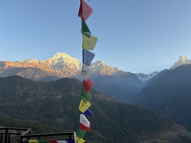 Peace flags in front, with the golden Annapurna range behind!