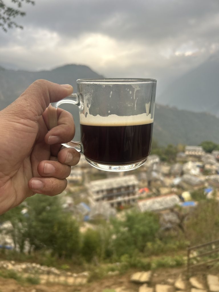 Coffee being held by a hand.