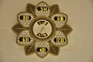 A clock with different time zones. From Grand Mosque, Abu Dhabi, United Arab Emirates.