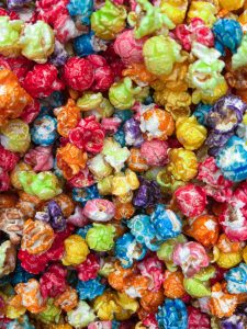 Close-up of colorful, sugary popcorn pieces
