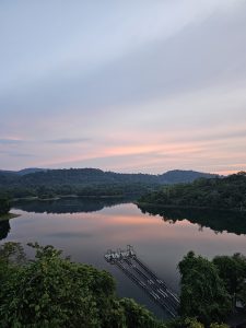 View of reservoir and forest during evening. Peechi Dam, Thrissur, Kerala. 