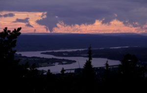 sunset in Lapland, Rovaniemi, Finland - scenery over river to fjells