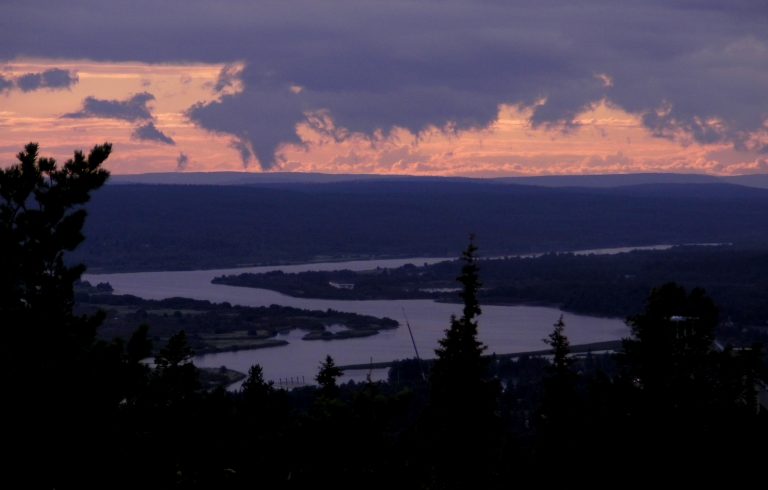 sunset in Lapland, Rovaniemi, Finland – scenery over river to fjells