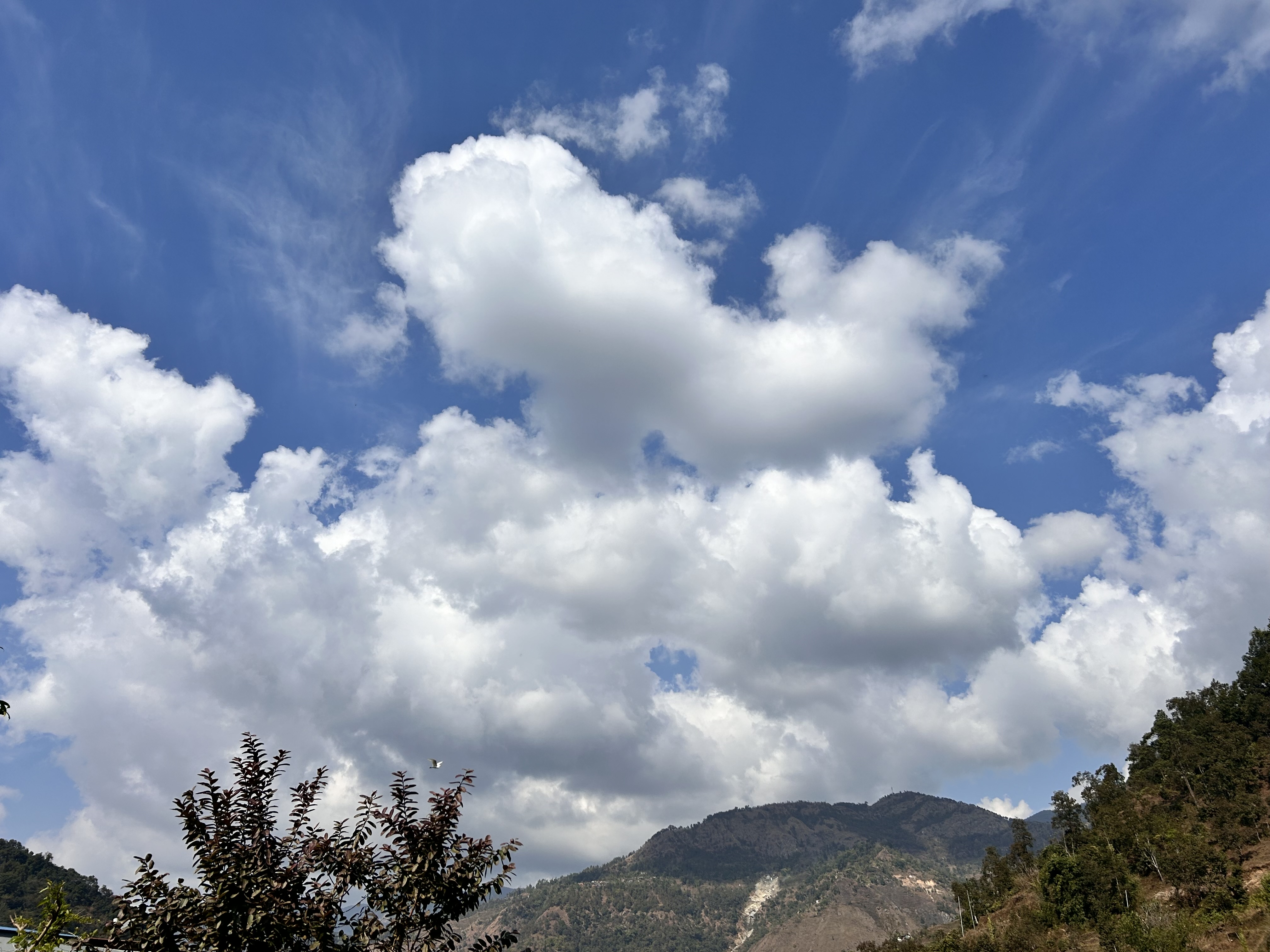 Cloudy sky and hills view.