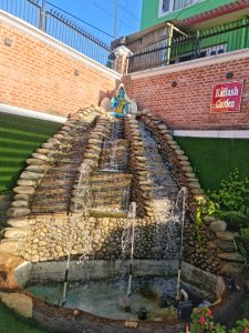 Artificial water fountains with Lord Shiva positioned at the top.