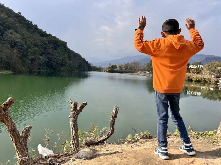 A child standing by the lakeside!