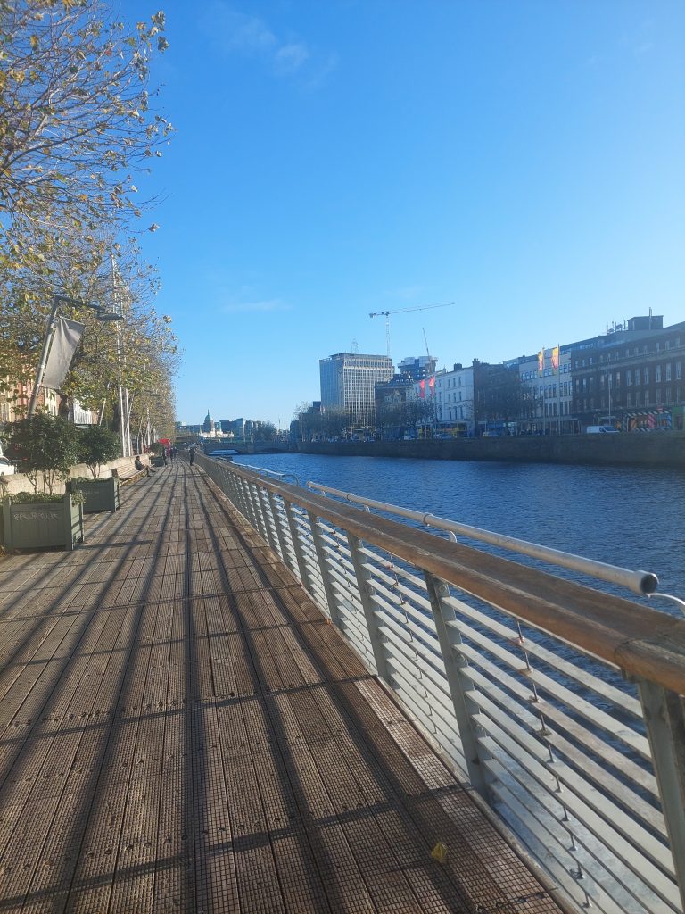Walking besides Liffey river, Dublin, Ireland