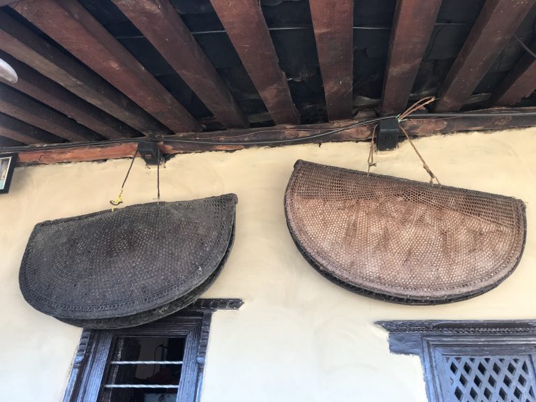 Bamboo syagu hanging on the wall of traditional village house