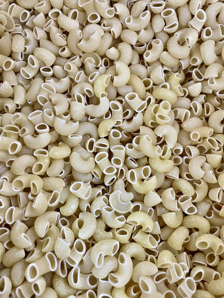 Close view of macroni pasta inside a big packet. From Kozhikode, Kerala.