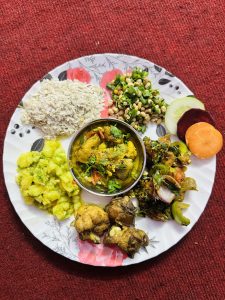 Newari Food – Specially popular in Newari community of Kathmandu Valley. It has chicken, pickles, veggies, etc
