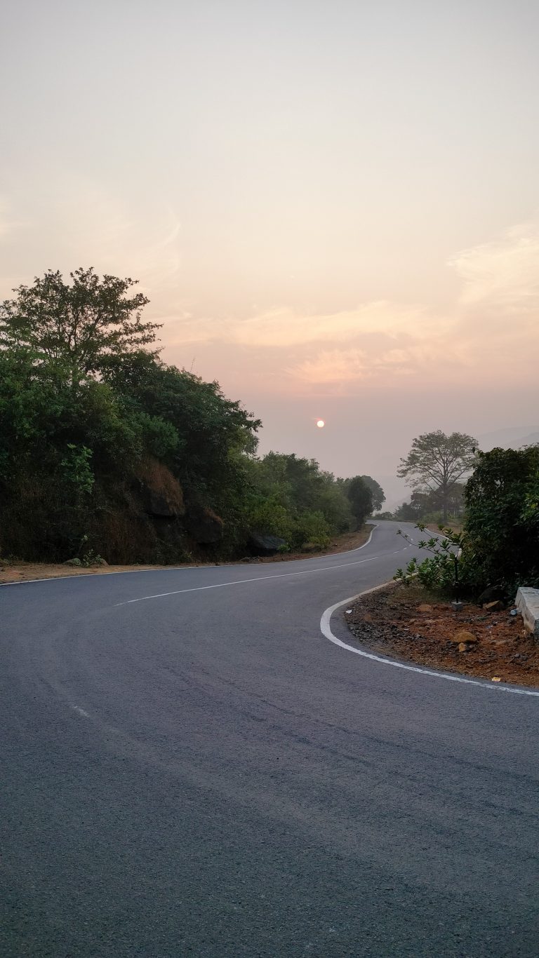 Sunrise in Kumbharli Ghat, Maharashtra. Empty road, Turning point.