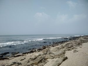 A scenic beach on Saint Martin's Island, Bangladesh, featuring sandy shores and crystal-clear water.