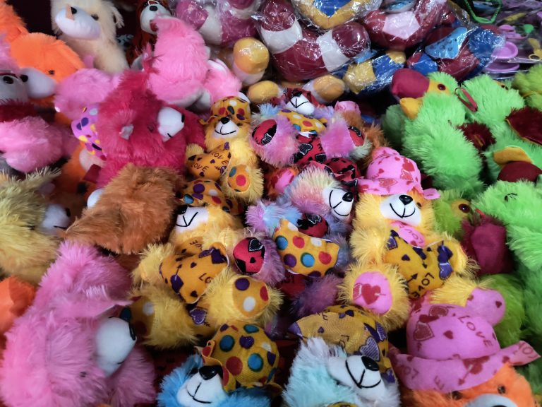 A collection of plush toys within a teddy bear store.