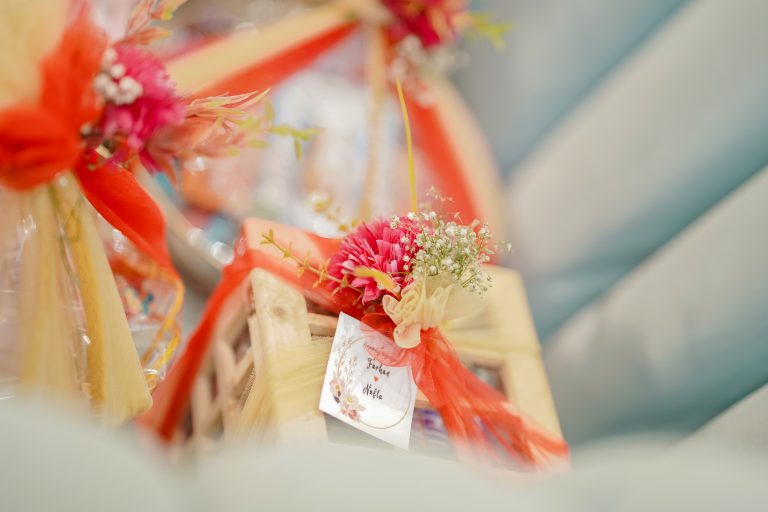 Wooden wedding gift with flowers and a card with names on it