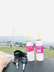 View larger photo: Two juices with straws and two sets of bike keys.