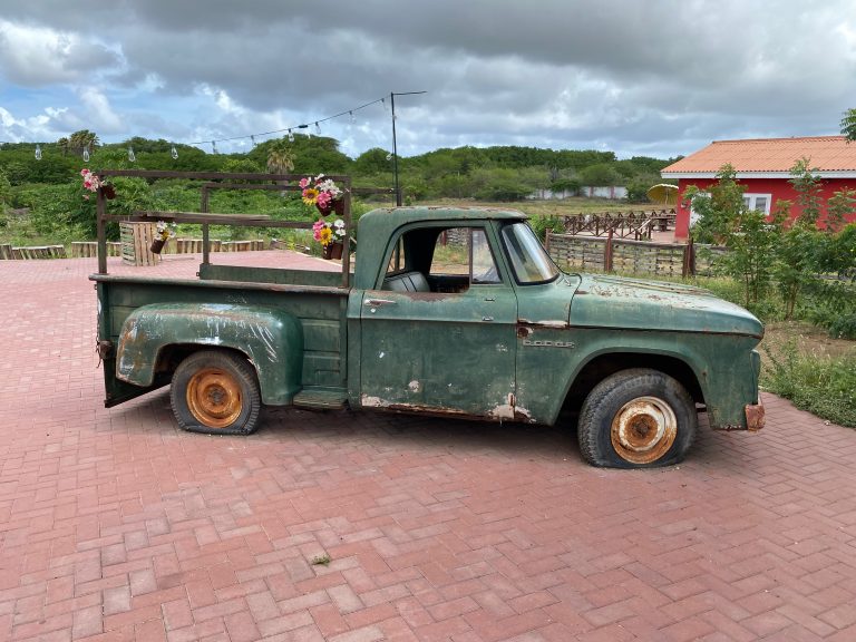 An old green Dodge pick-up with flat tires at the farm of Hofi Cas Cora on the island of Cura?ao.